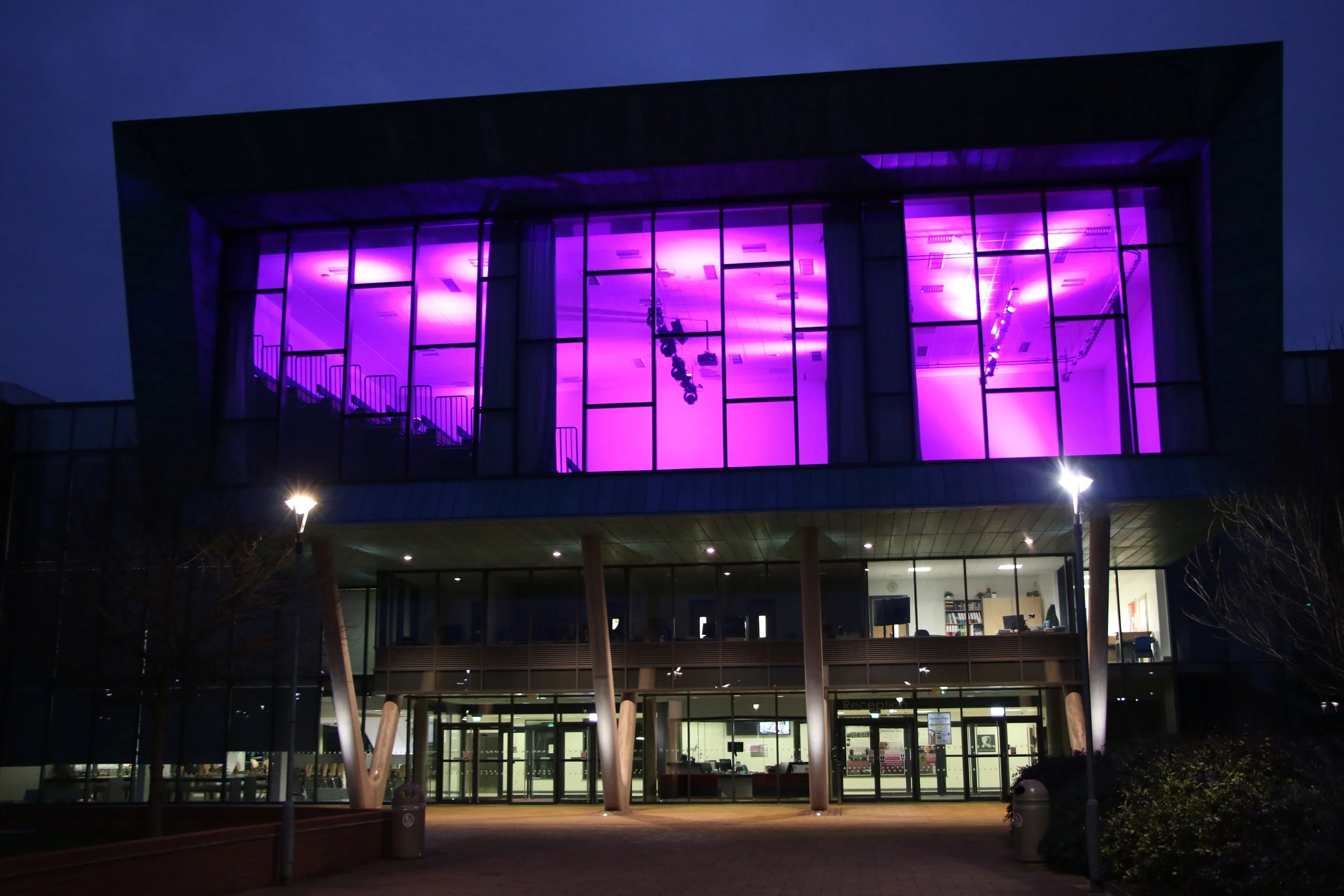 Building lit in purple for Holocaust Memorial Day