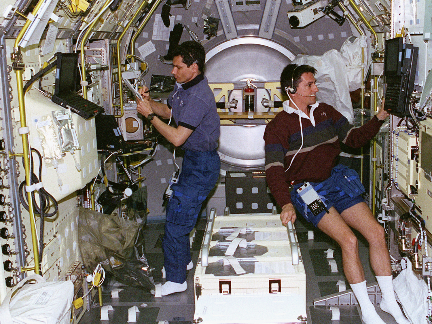  Working with Greg Linteris in the Spacelab module. 