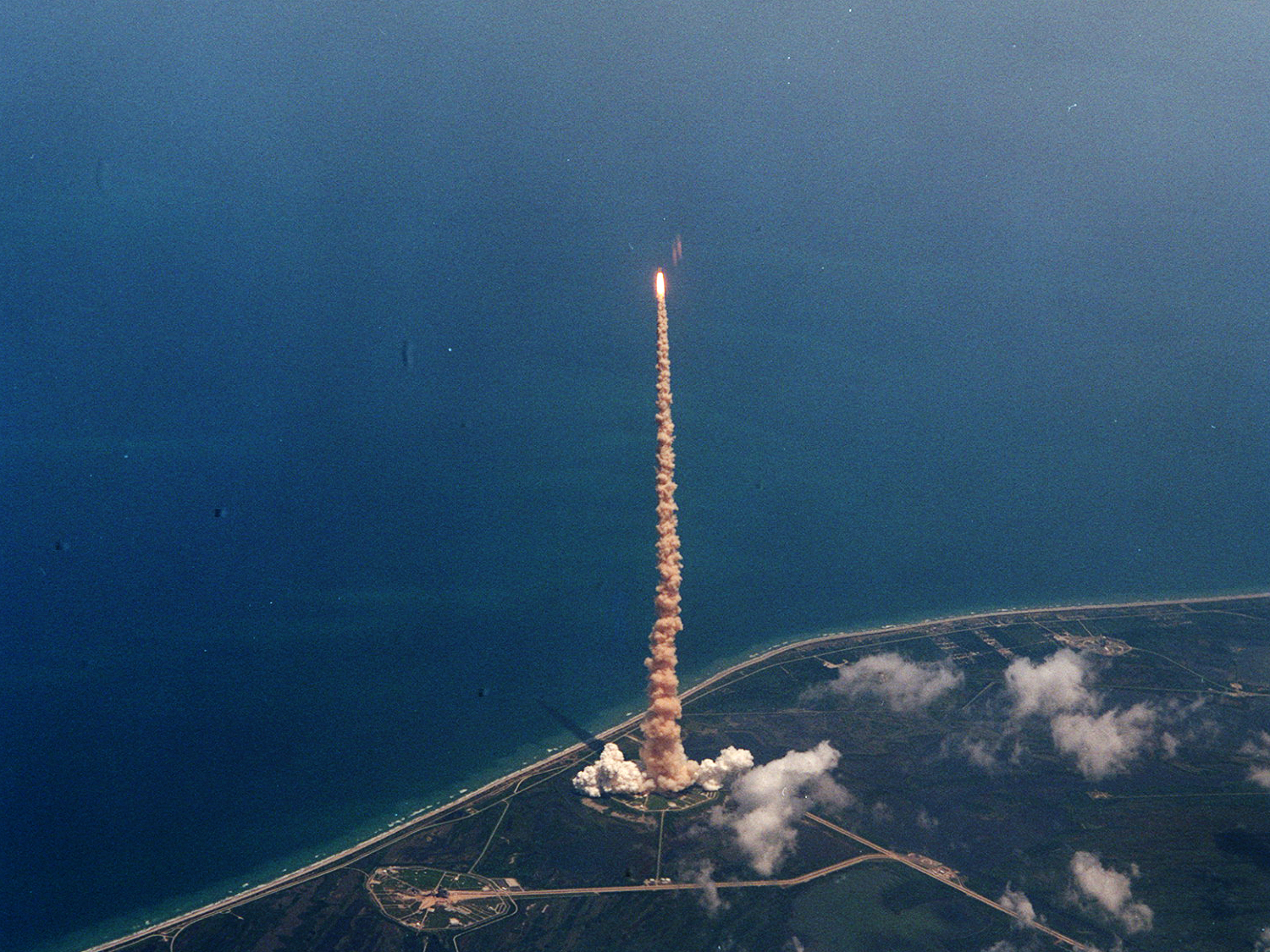  View of STS-94 launch taken from the Shuttle Training Aircraft flown by astronaut Ken Cockrell. 