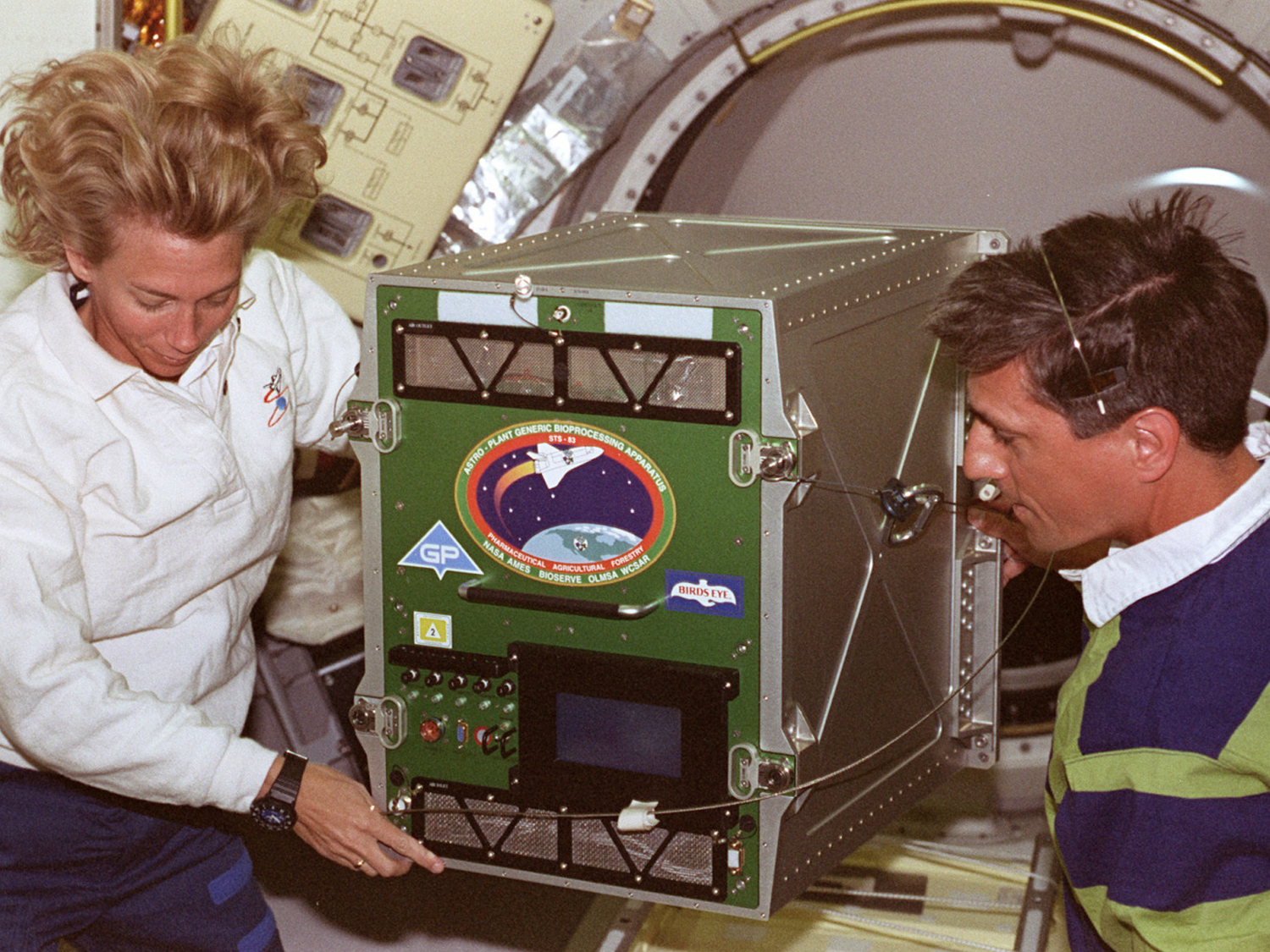  Susan (Still) Kilrain and I transferring experiment from middeck to Spacelab. 