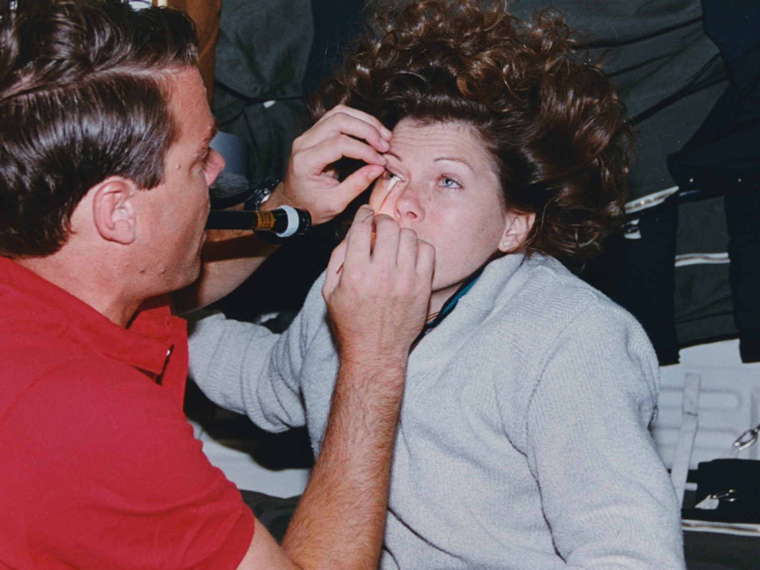  Dr. Kregel removes dust particle in eye.&nbsp; 