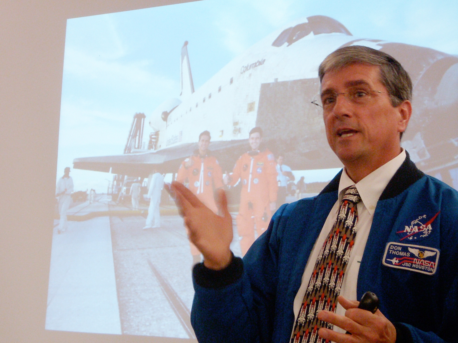 Discussing the importance of teamwork to a group of employees.