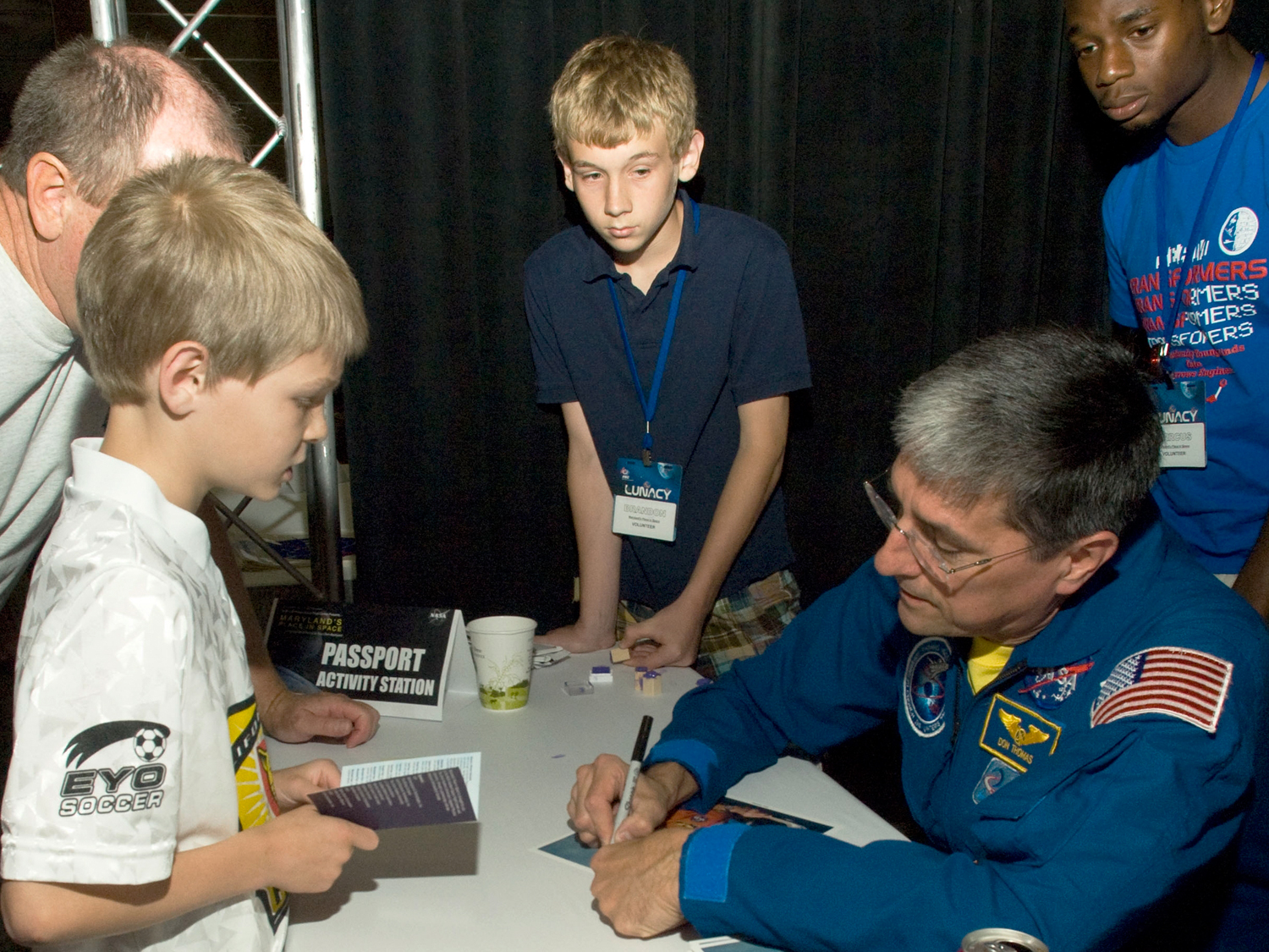 Meeting students and signing autographs.