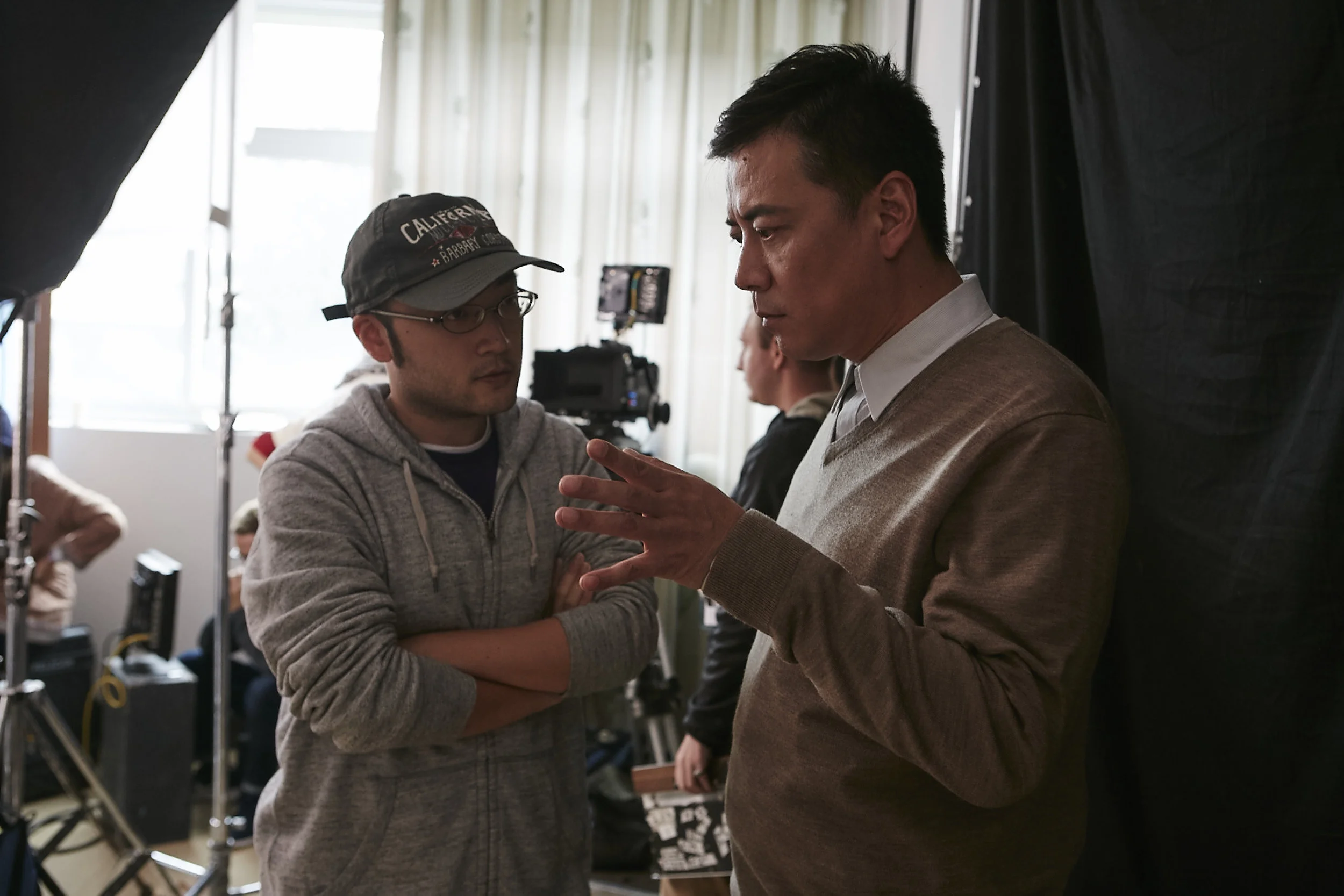 Director Jianjie Lin (Left) discussing a scene with actor Shengsheng Zhao