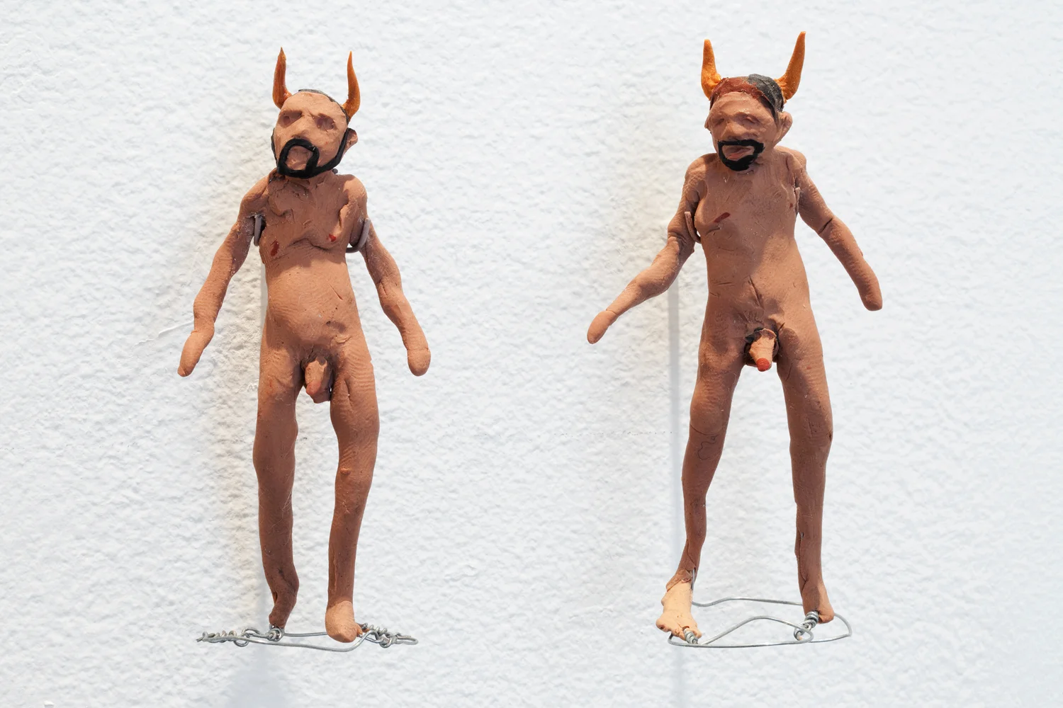 Michael Minelli Devil #1 and Devil #2 , 2011 Sculpey III 1: 1.75" x 2" x 3.75"; 2: 2" x 2" x 3.75" Retail Value: $2550 Opening Bid: $800