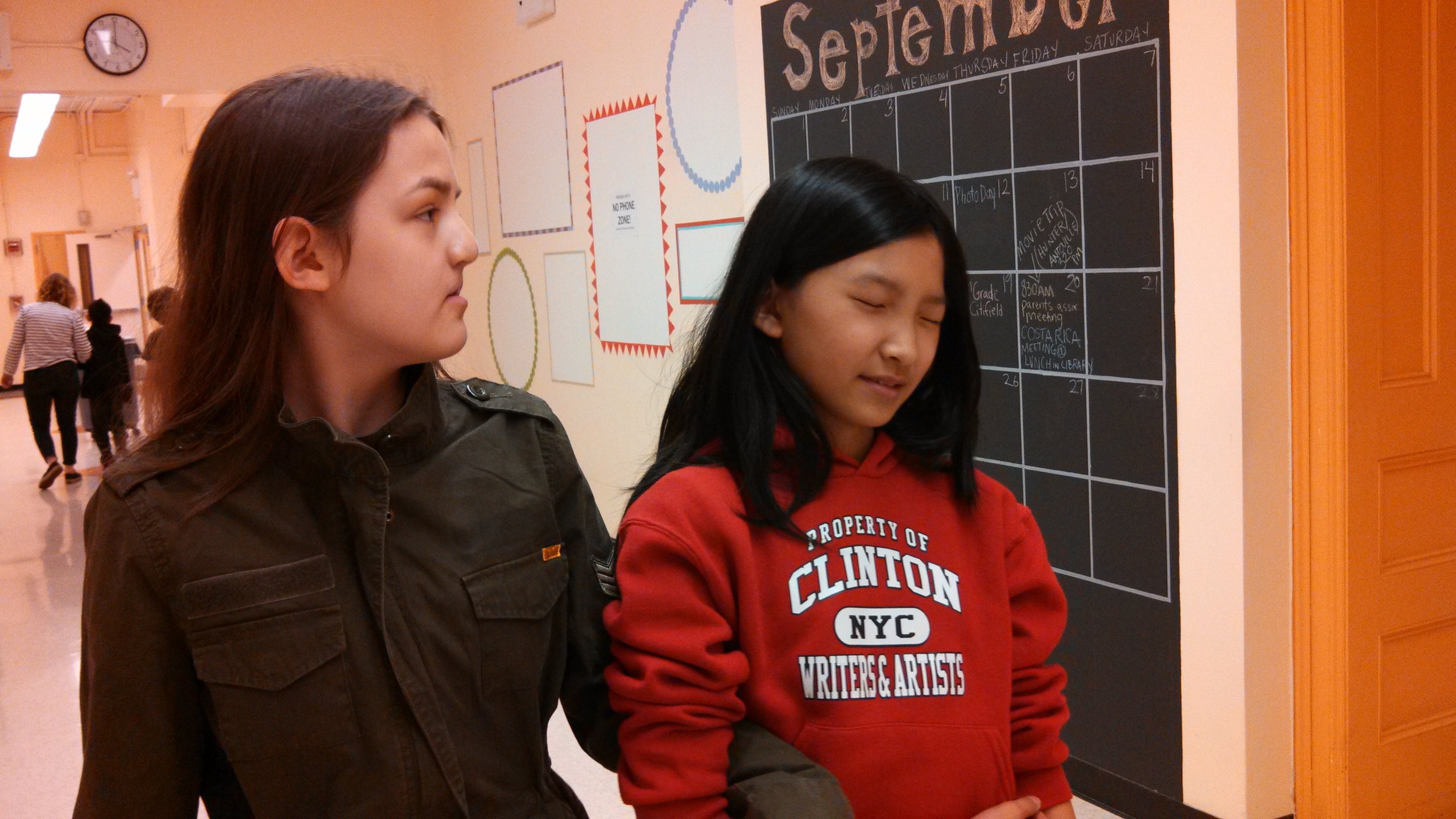 Students participate in "blind orienteering" (trust walk) inspired by Carmen Papalia's exhibition.