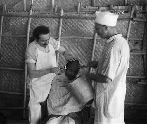 AVATAR MEHER BABA in India cutting a the hair of a mast - a God-intoxicated soul. 