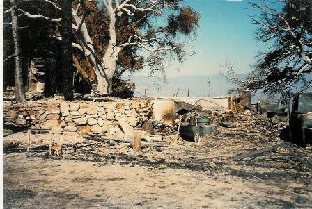 THE REMAINS OF THE FARMHOUSE and workshop after the October 14, 1985 New Life Fire. This is the site of the new Workshop completed in 2012. (Sam Ervin photo, October 1985.)