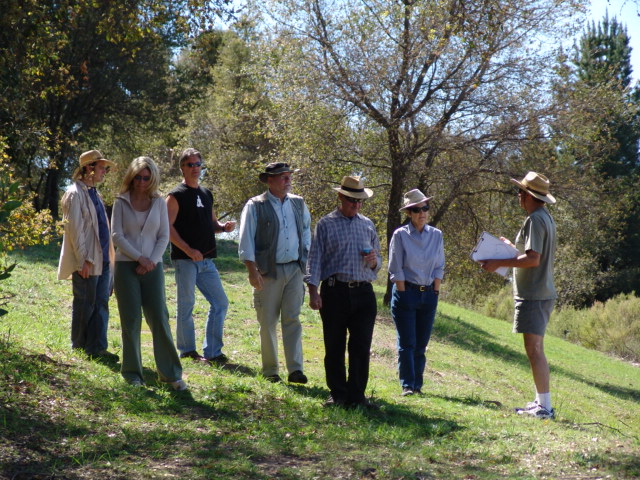 PLANNING DISCUSSIONS for the proposed Workshop. (Left to right): Glenn Russ, Elizabeth Arnold (Manager/Caretaker), Ray Johnston (Manager/Caretaker), Byron Pinckert, Sam Ervin (Board President), Margaret Magnus (Board Secretayr), and Jamshid Ebrahimzadeh (Board Members). (Nancy Pinckert photo, 2007.)