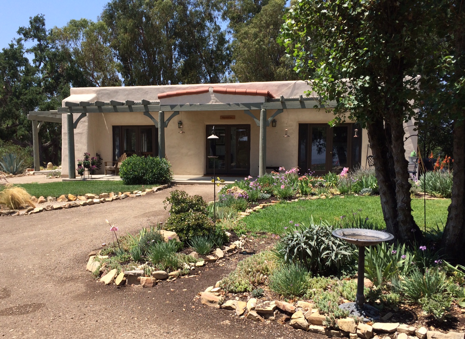 THE VISITOR CENTER and Caretaker Quarters after the all the repairs have been made and painting finished. The building was originally constructed in 1994 as a home for then caretaker Agnes Baron. It was designed by Michel Saint-Sulpice. (Buzz Glasky photo, 2014.)