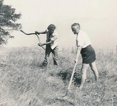 AGNES BARON (left) and Margaret Craske (right) doing weed clearing chores at Meher Mount. This photo was probably taken around the time of the month of silence in 1949.