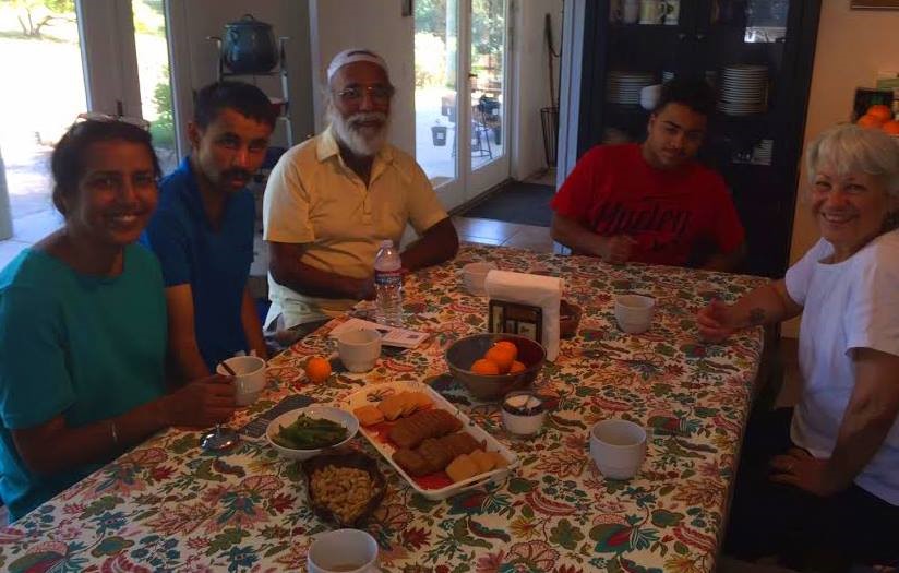 Deviner Chana, his sister Harjinder, and son Devin are sitting at the kitchen table with our grandson Austin Bernard and Ginger Glasky. (Photo: Buzz Glasky, April 2015) 