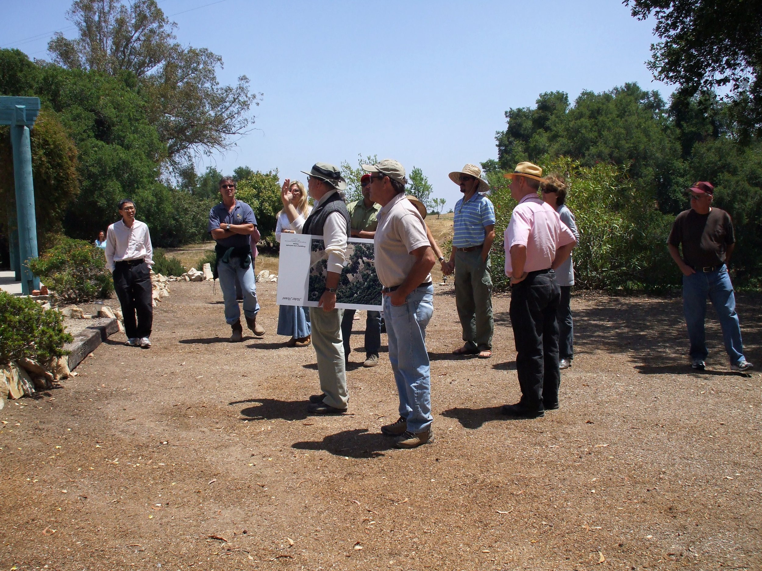 ONE OF MANY long-range planning discussions. Pariticipants (left to right): Kanji Miyao; Ray Johnston (Manager/Caretaker); Elizabeth Arnold (Manager/Caretaker); Byron Pinckert (Volunteer Consulting Architect); Ron Holsey (Board Member); Jim Auster (Board Member); Ellie Azhang (hidden); Jamshid Ebrahimzadeh (Board Member); Sam Ervin (Board President); Nancy Pinckert (Volunteer Graphic Designer); and Jim Whitson (Board Member). (Photo: Margaret Magnus, 2008)