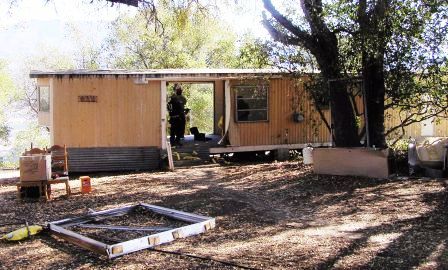 THE TRAILER brought onto the property after the 1985 New Life Fire by Board member Bing Heckman. Agnes Baron lived here until the Visitor Center/Caretaker Quarters was built in 1994. This photo is many years later in 2007 when the trailer was eventually demolished and removed from the property. (Photo: Ray Johnston, 2007)