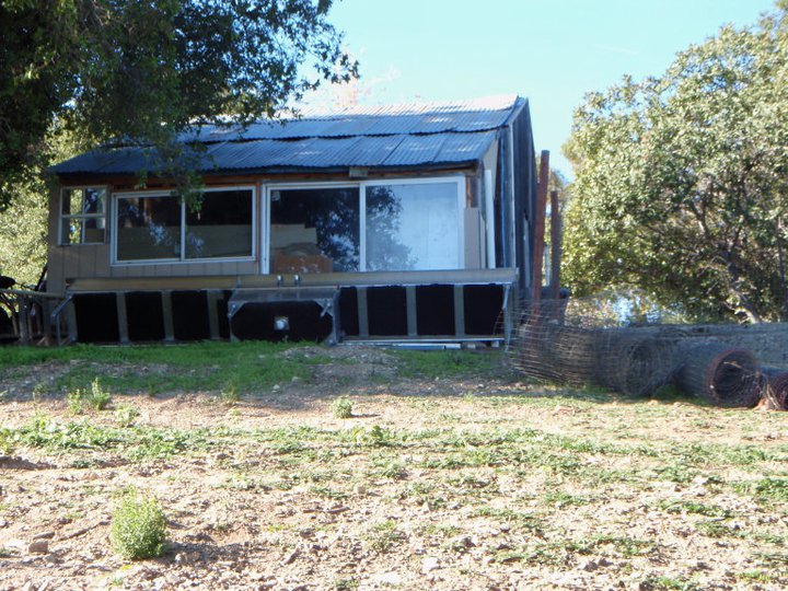 THE DOWNHILL SIDE of the "temporary" workshop built in 1985. A side "porch" addition had been slightly upgraded to provide a pottery workshop for Manager/Caretaker Lilly Weichberger in 2005. (Margaret Magnus photo, 2010.)