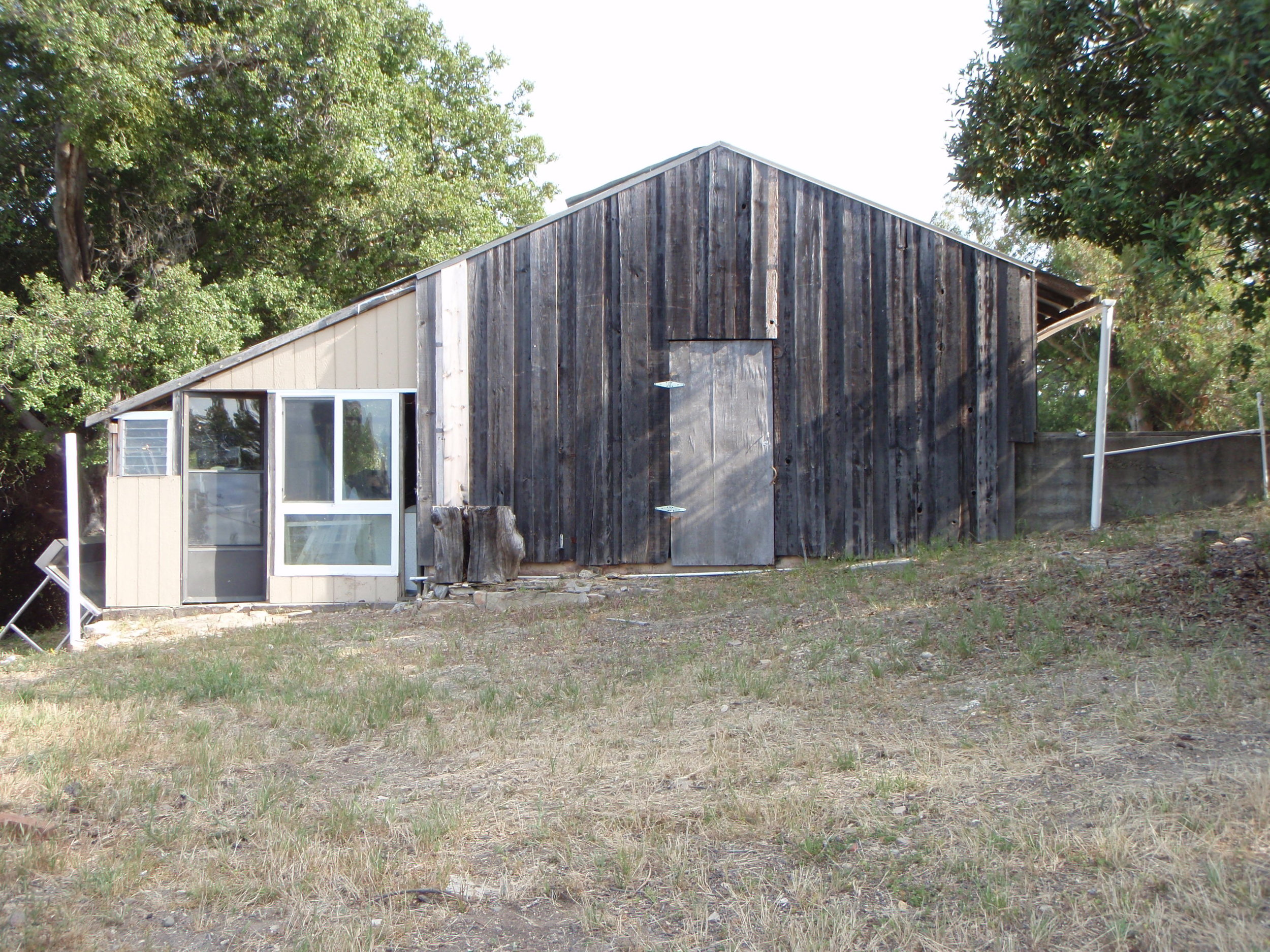 THE BACK DOOR of the "temporary" workshop built in 1985. This would become the site of the Topa Topa Patio built in 2012. (Margaret Magnus photo, 2010.)