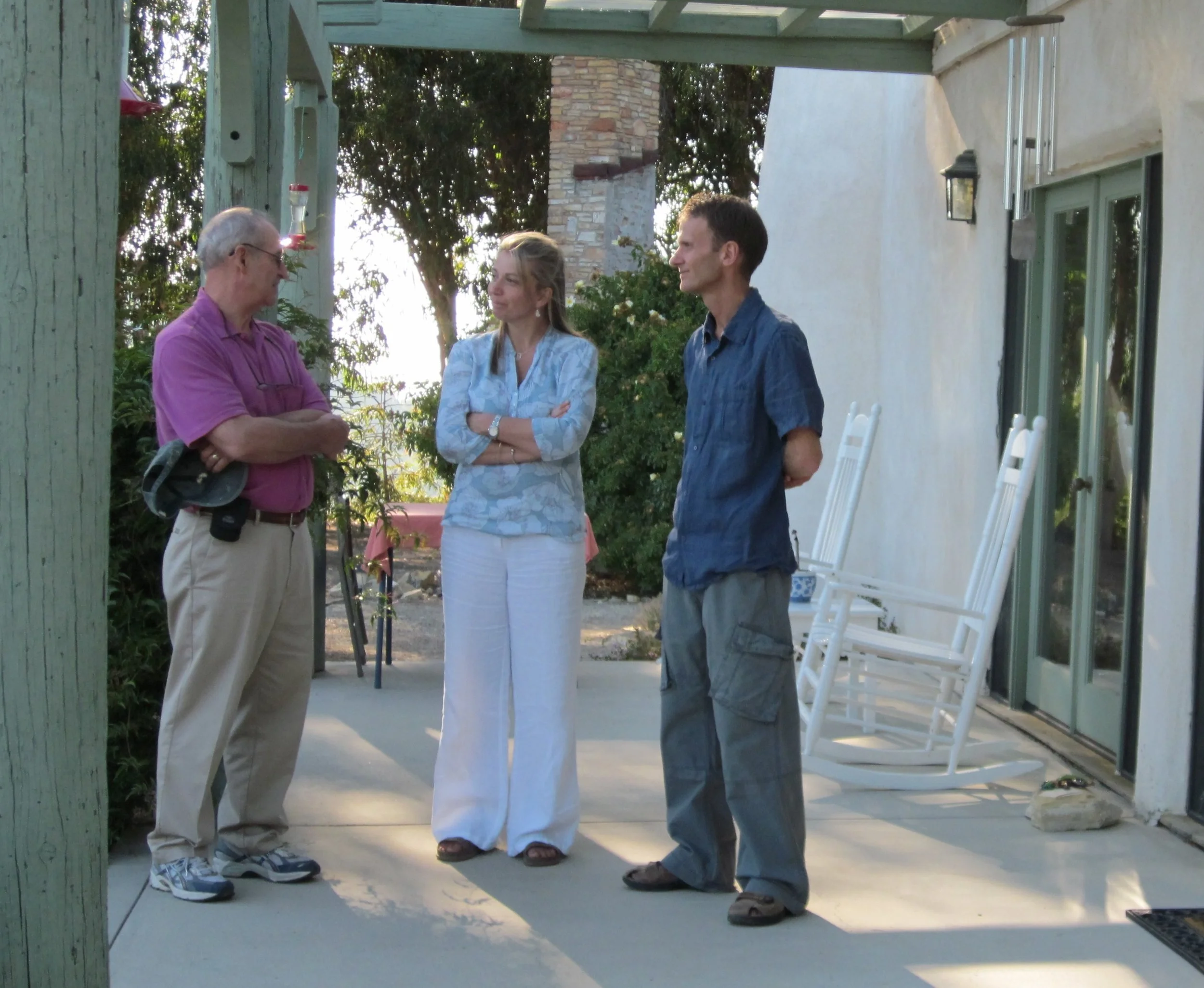 SAM ERVIN, SAMANTHA BRIDGER & LESLIE BRIDGER on the porch of the Visitor Center/Caretaker Quarters at Meher Mount. (Photo: Wayne Myers, 2010)