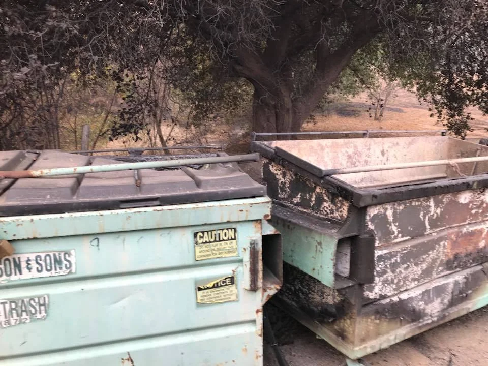 "A LITTLE HUMOR, ME THINKS," wrote Buzz Glasky in his December 7, 2017, post on Facebook. All the garbage dumpsters at the foot of Sulphur Mountain Road burned except Meher Mount's. (Photo: Buzz Glasky)