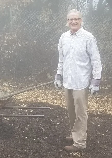 TIM HURLEY spreading the mulch under Baba's Tree at Meher Mount. (Photo: Margaret Magnus, March 10, 2018)