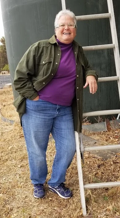 INTERIM CARETAKER Cassandra Bramucci is smiling because all her work for weed abatement means the job will get finished. (Photo: Margaret Magnus, May 20, 2018)