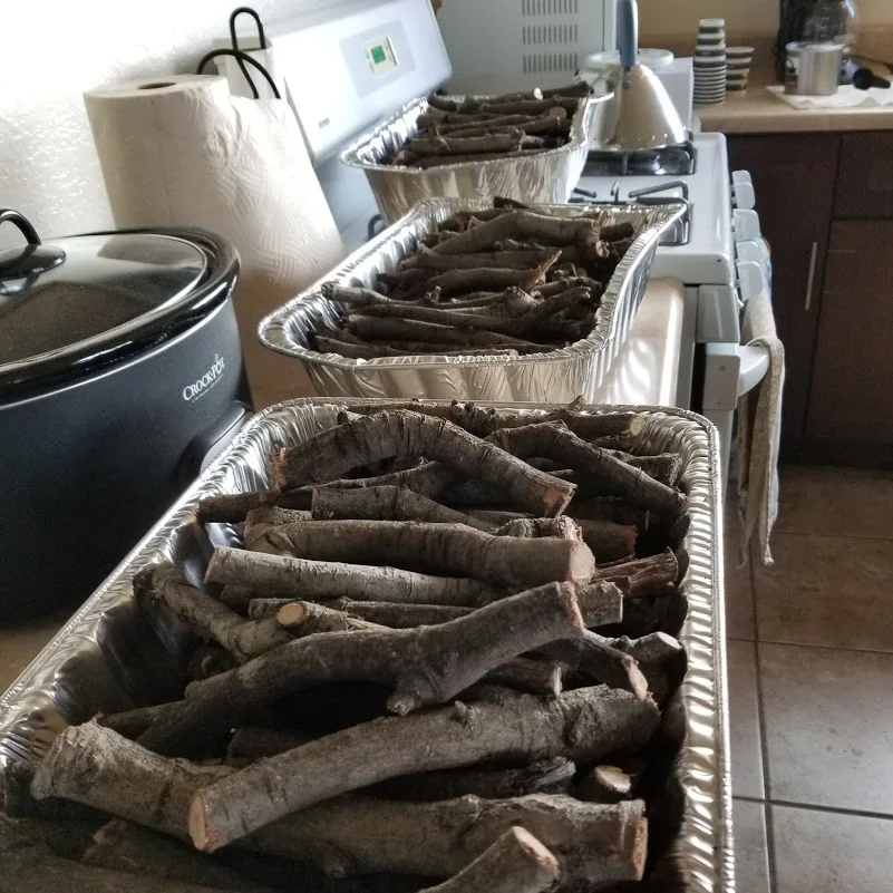 BAKED DHUNI STICKS cooling after coming out of the 200-degree oven for six hours. The baking process is to rid the wood of pests before sending the dhuni sticks to other Meher Baba groups. (Photo: Margaret Magnus, January 12, 2019)