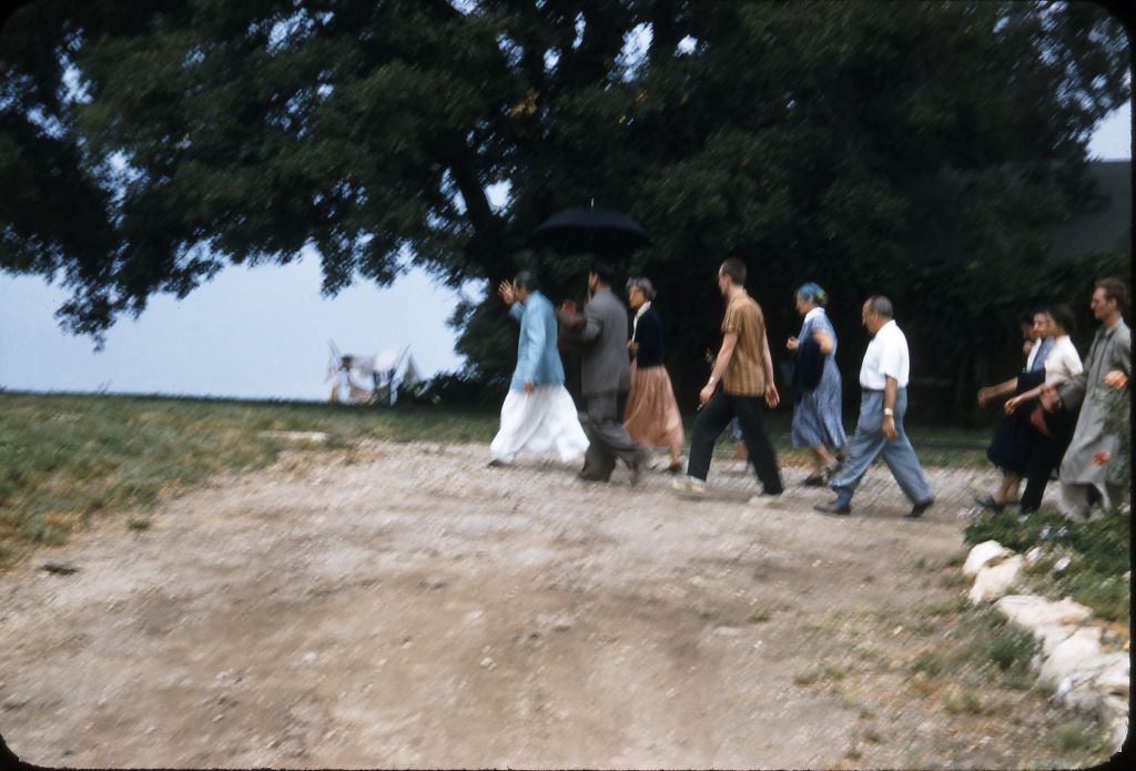 AVATAR MEHER BABA just before He steps on a flagstone walkway at Meher Mount, now known as Baba’s Walkway. It is one of the remnants of the 1985 fire that destroyed all the buildings and vehicles on the property, leaving few artifacts from His 1956 visit. (Photo: Darwin Shaw, ©Meher Nazar Publications)