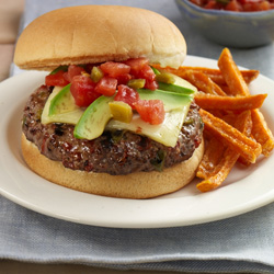 These burgers will give you a spicy summer kick! Spicy tomatoes and green chilies are cooked right in the burger and then topped with pepper jack cheese, tomatoes, and fresh avocado slices. Photography and recipe found at: readyseteat