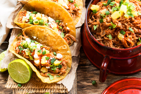These tacos are the perfect summer comfort food! From sweet to salty, and a little spice this meal will have your mouth watering. Toppings include cilantro, goat cheese, green onions, and pineapples of course! Photography and recipe found at: glutenfreewithlb