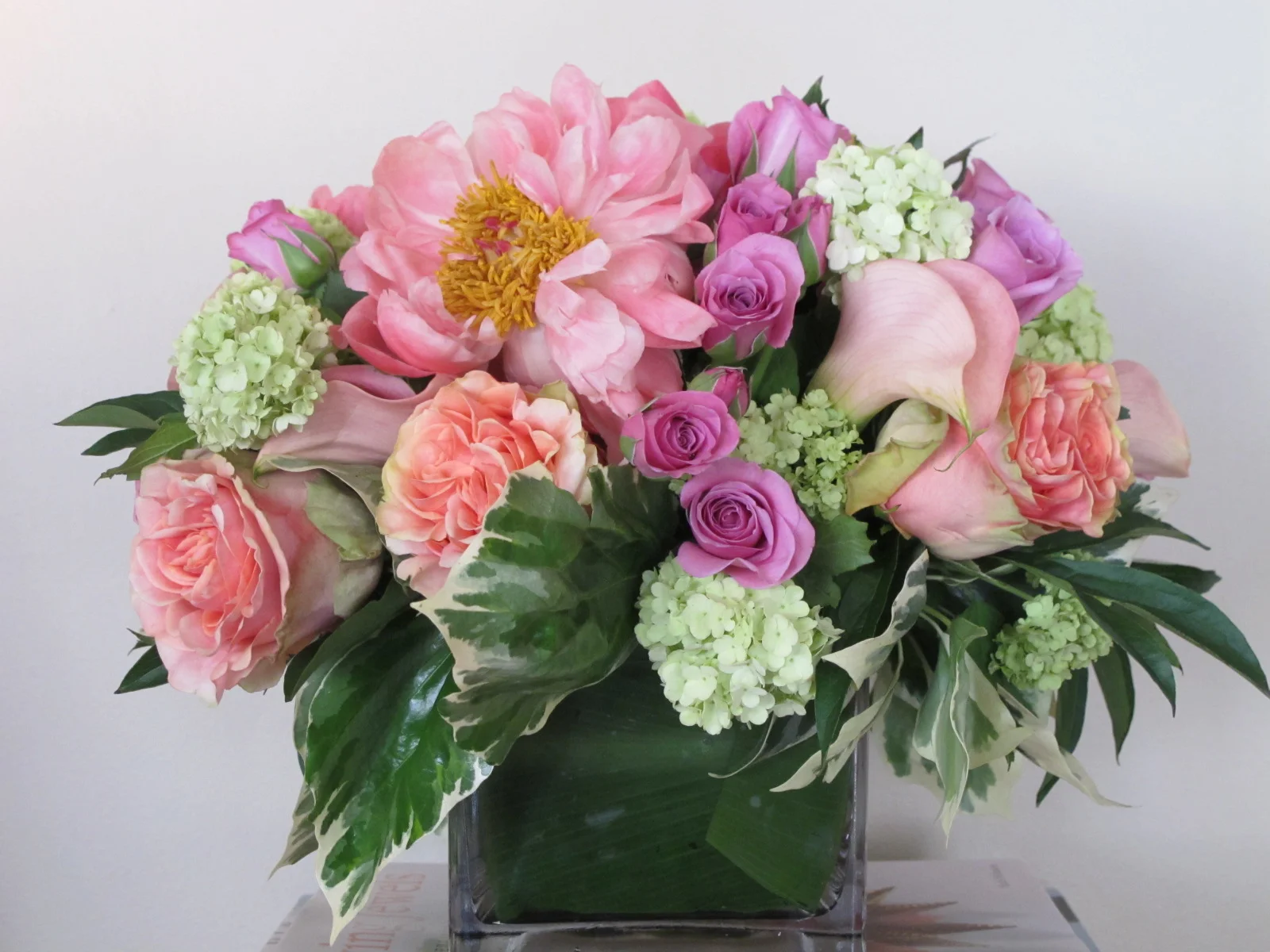 Roses, spray roses, peonies with accents of viburnum