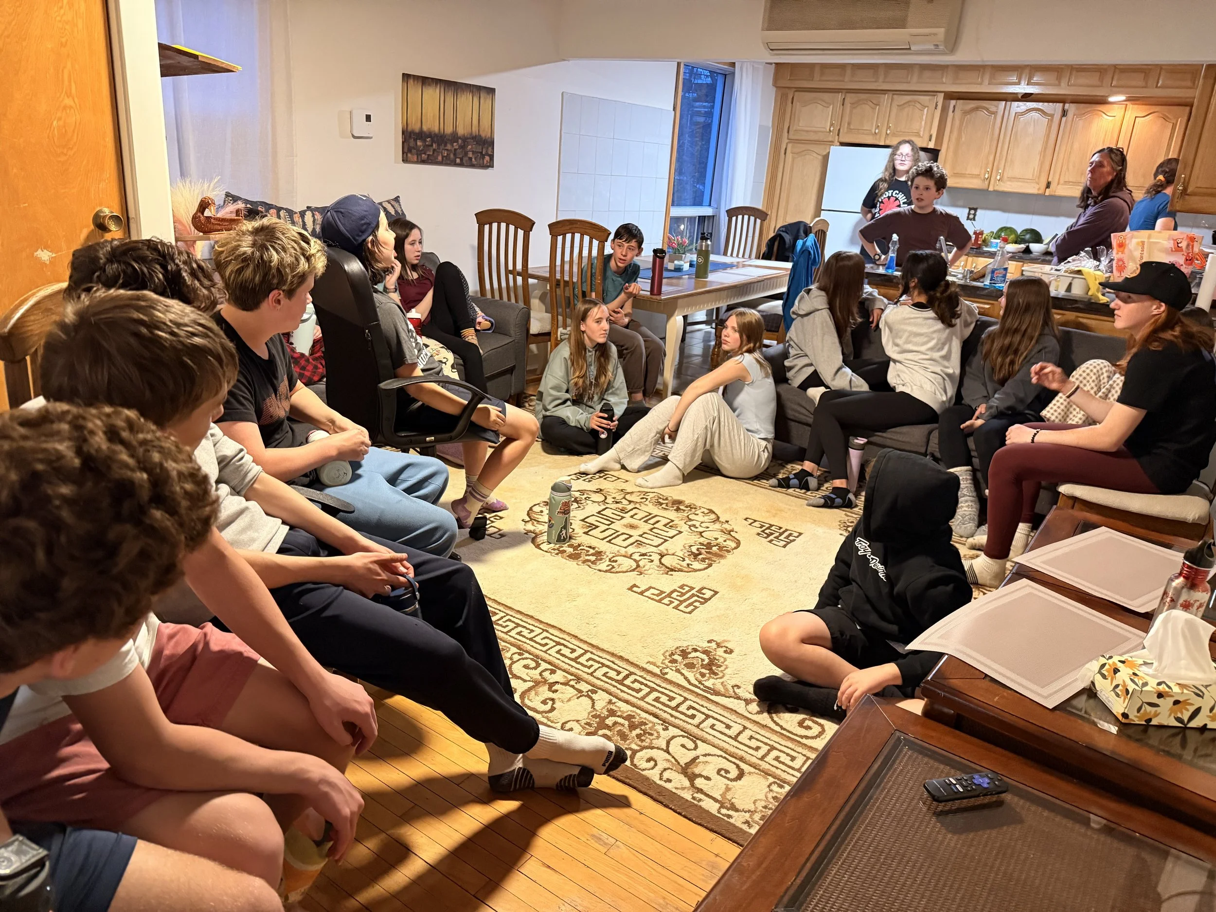 Junior High students meet to plan during their trip to Montreal