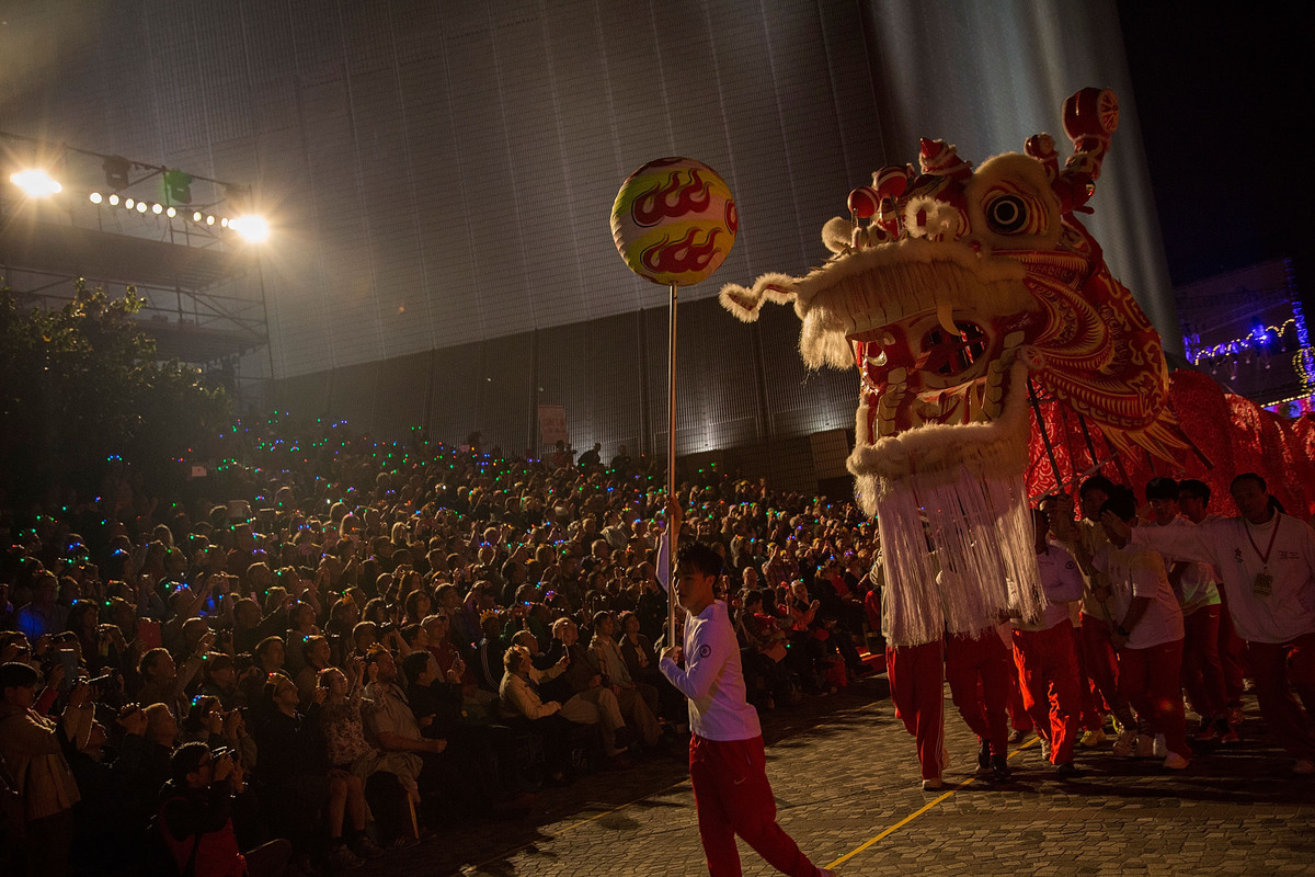 HONG KONG - JANUARY 31: Performers dance at the 2014 Cathay Pacific International Chinese New Year Night Parade on January 31, 2014 in Hong Kong, Hong Kong. The parade featured illuminated floats accompanied by local and international performing groups which entertained both locals and tourists alike on Chinese Lunar New Year.ÊHundreds of thousands gathered in Hong Kong today to celebrate the Chinese New Year and welcome the Year of the Horse, with new year's day falling on January 31st. Chinese new Year is the most important festival in the Chinese calendar and is widely celebrated across Asia. (Photo by Lam Yik Fei/Getty Images)