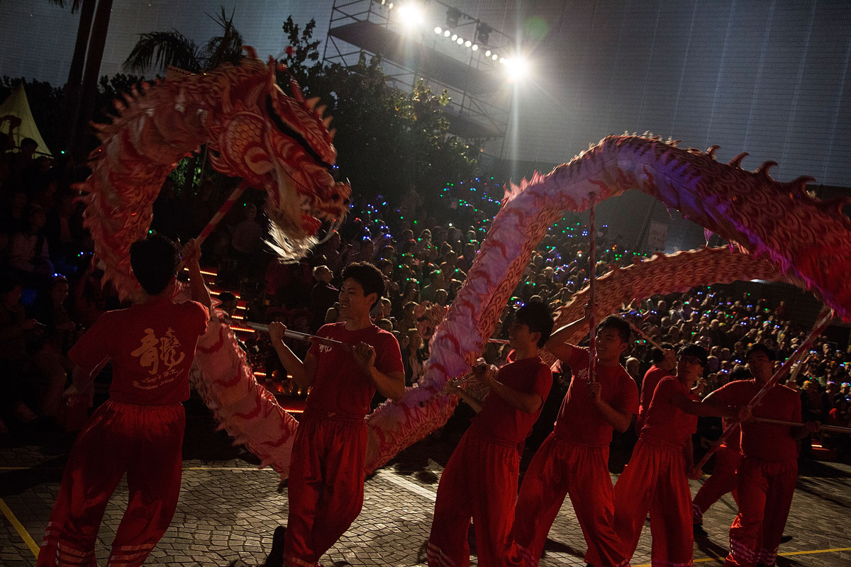 HONG KONG - JANUARY 31: Performers dance at the 2014 Cathay Pacific International Chinese New Year Night Parade on January 31, 2014 in Hong Kong, Hong Kong. The parade featured illuminated floats accompanied by local and international performing groups which entertained both locals and tourists alike on Chinese Lunar New Year.ÊHundreds of thousands gathered in Hong Kong today to celebrate the Chinese New Year and welcome the Year of the Horse, with new year's day falling on January 31st. Chinese new Year is the most important festival in the Chinese calendar and is widely celebrated across Asia. (Photo by Lam Yik Fei/Getty Images)