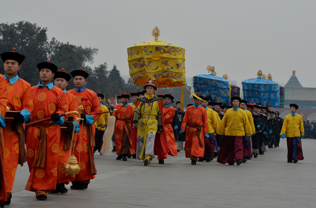 Chinese performers during a traditional Qing Dynasty ceremony in which emperors prayed for good fortune, during Lunar New Year festivities at the Temple of Heaven in Beijing on January 31, 2014. China welcomed in the Year of the Horse which sees about 3.62 billion trips made by Chinese travelers during the 40-day Spring Festival travel period. AFP PHOTO/Mark RALSTON (Photo credit should read MARK RALSTON/AFP/Getty Images)
