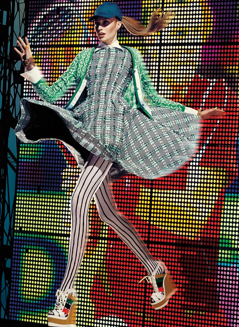 Shirt, $270, sweater, dress and tights, all price on request, all by Thom Browne. Shoes, $895, by Pierre Hardy. Hat, price on request, by Max Mara. Bangles, from $565, both by Hermès.