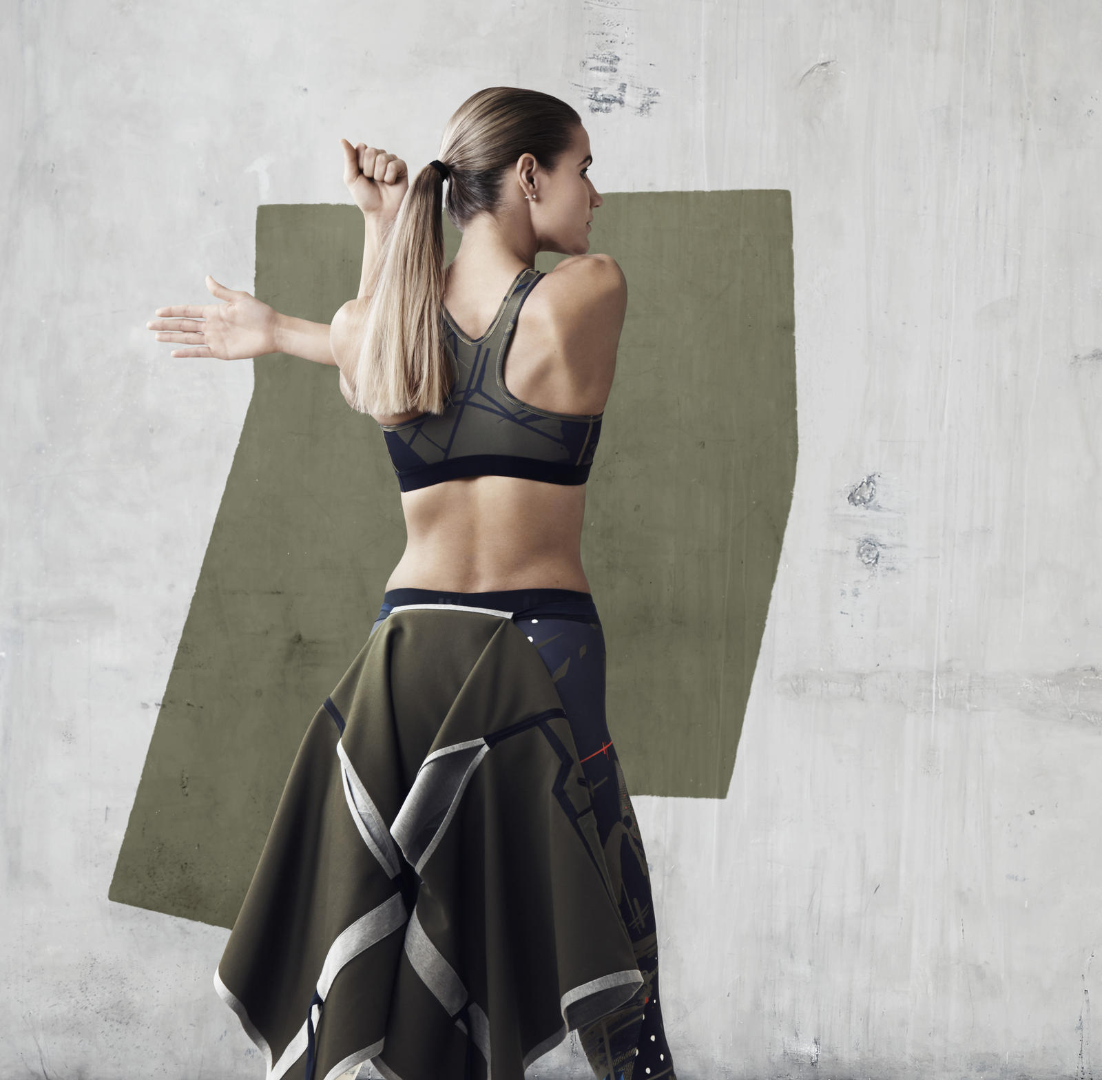 Lithuanian High Jumper, Airinė Palšytė, wears NikeLab x JFS Printed Bra, NikeLab x JFS Sleeveless Cape and NikeLab x JFS Printed Tight.