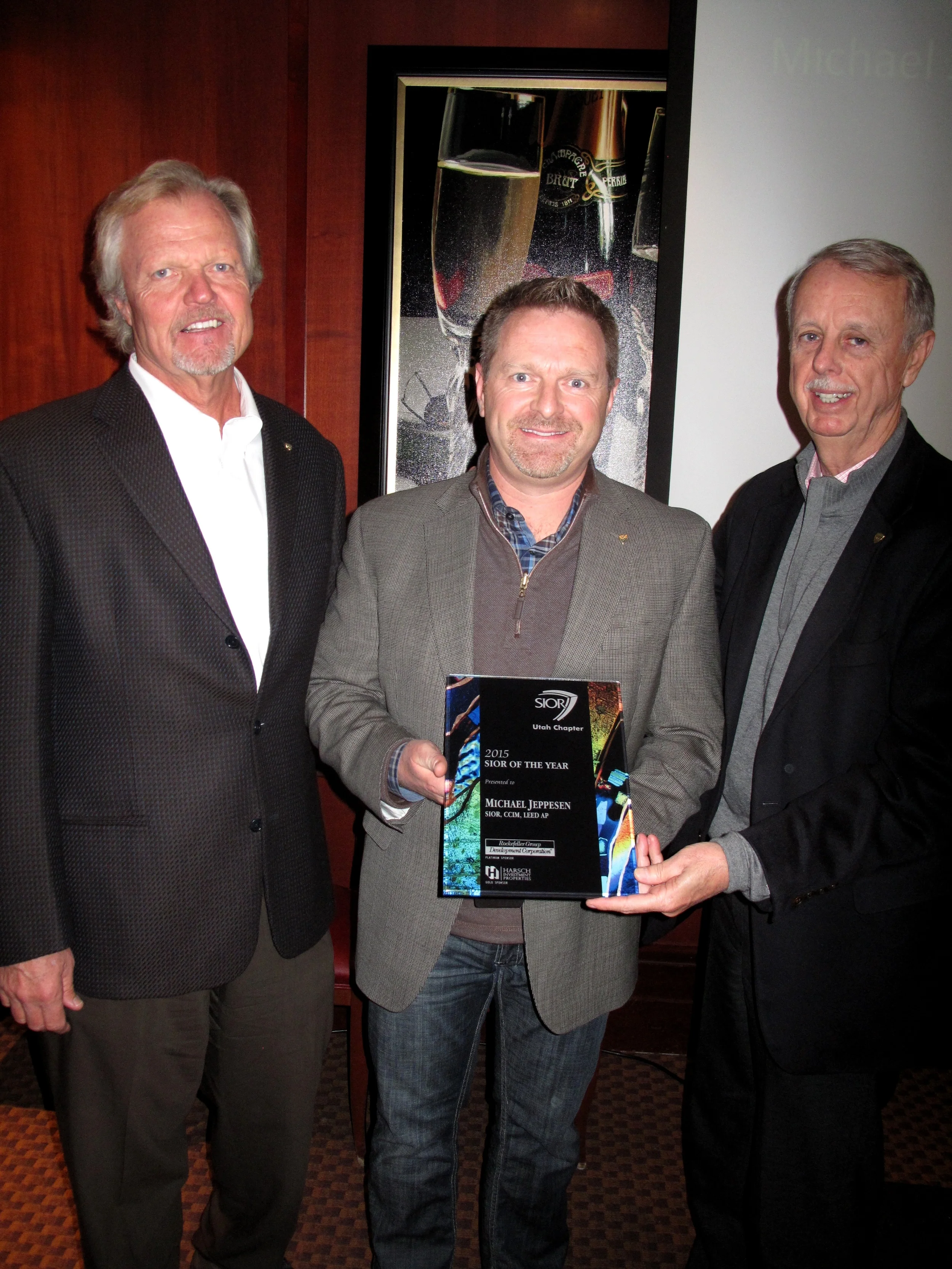 Bill Rodewald from Harsh Investments and Tom McCormick from Rockefeller Group with Michael Jeppesen the SIOR of the Year Recipient 