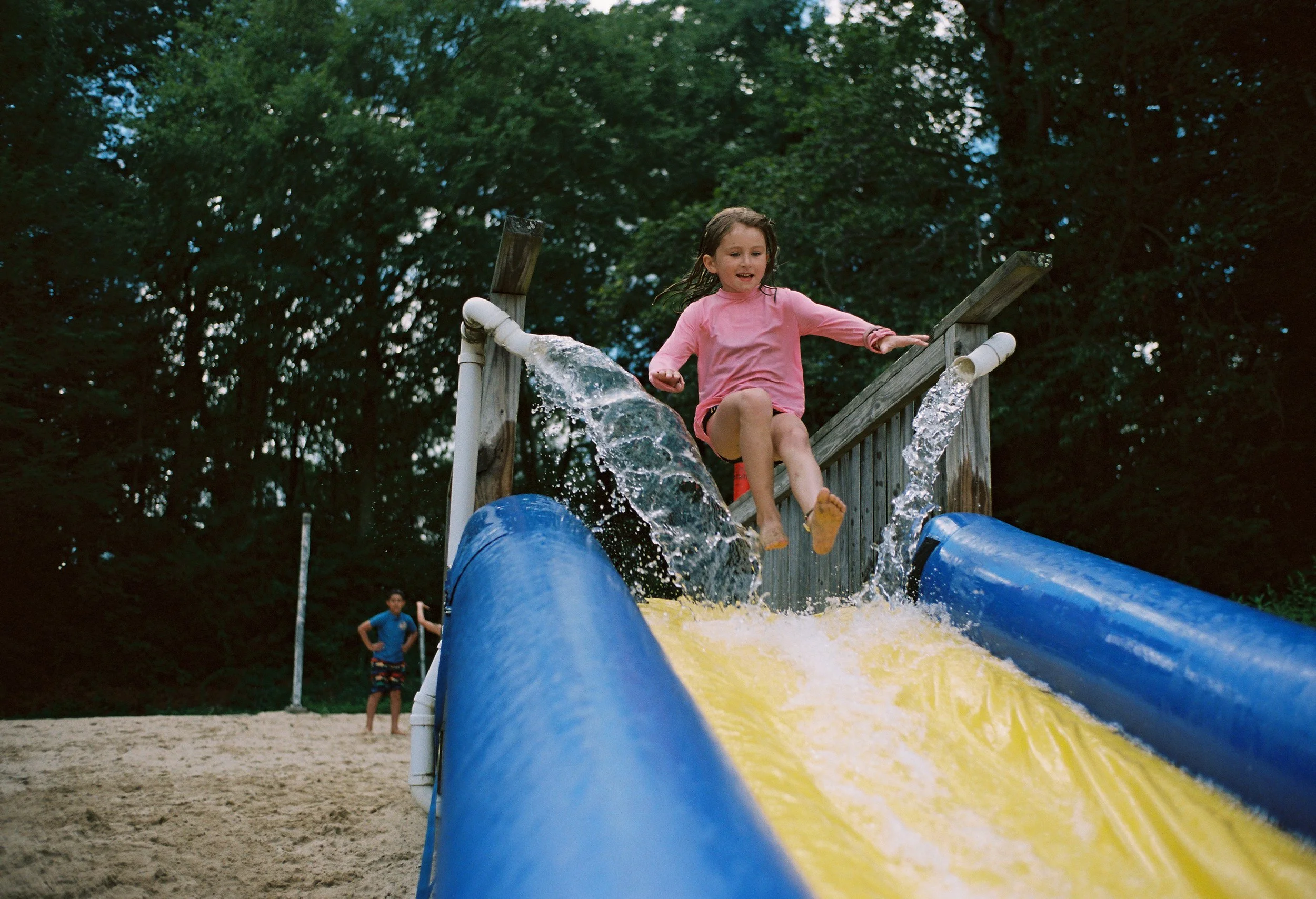 patrick-fraser-lifestyle-pink-water-slide-jump.jpg