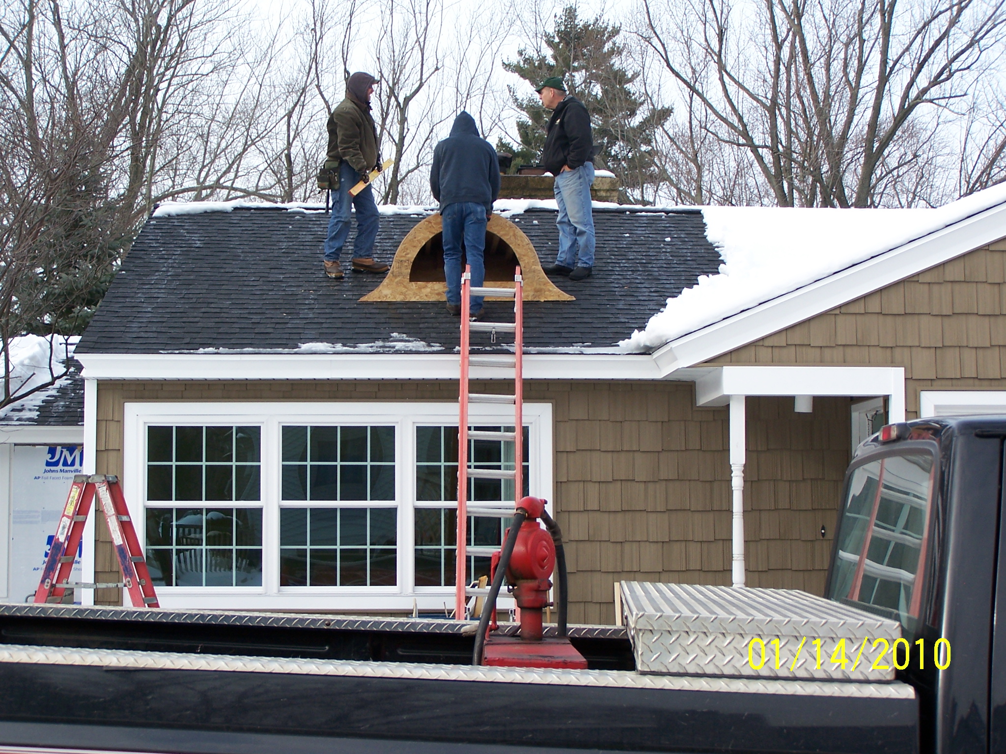 Roofing contractors at work