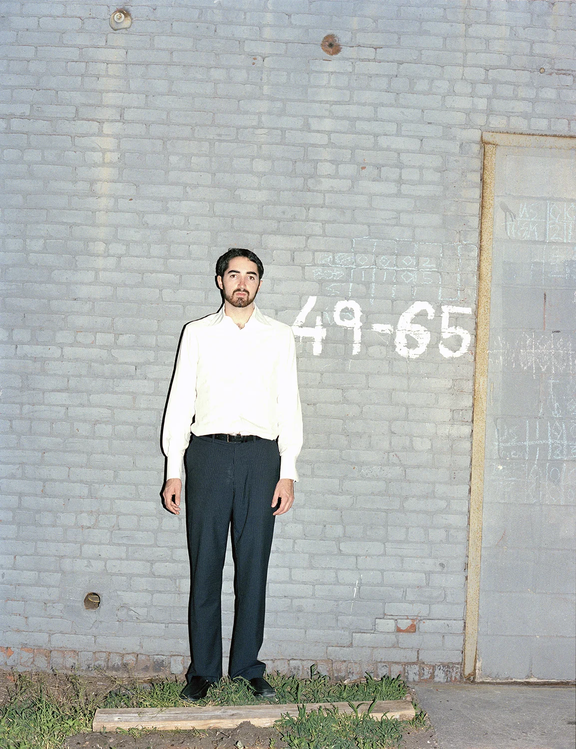 Sam Valenti against wall.jpg