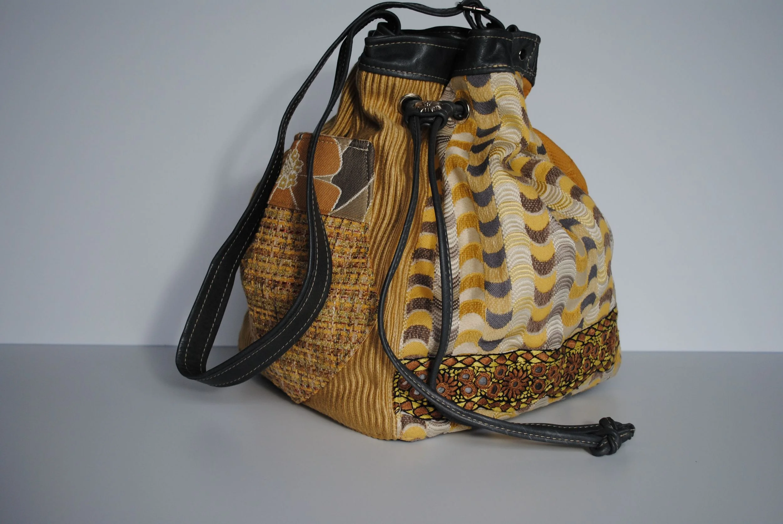 Discombobulated Yellow Tapestry Grey Leather and Mirror Embroidered Square Drawstring Batwa