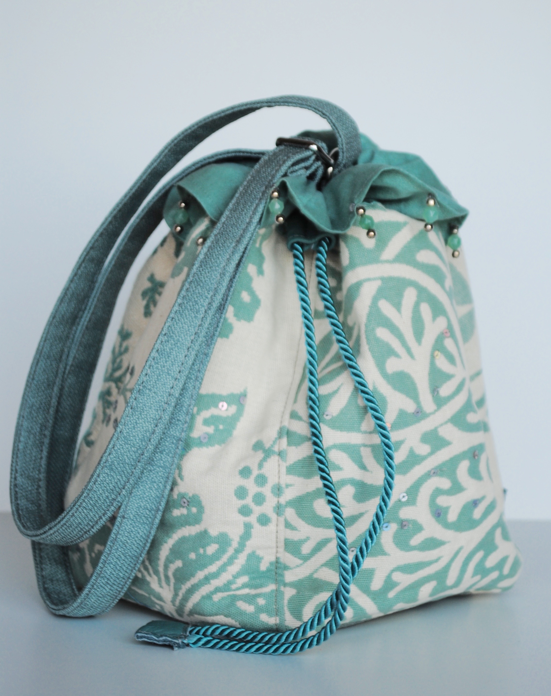 Discombobulated Turquoise Drawstring Messenger