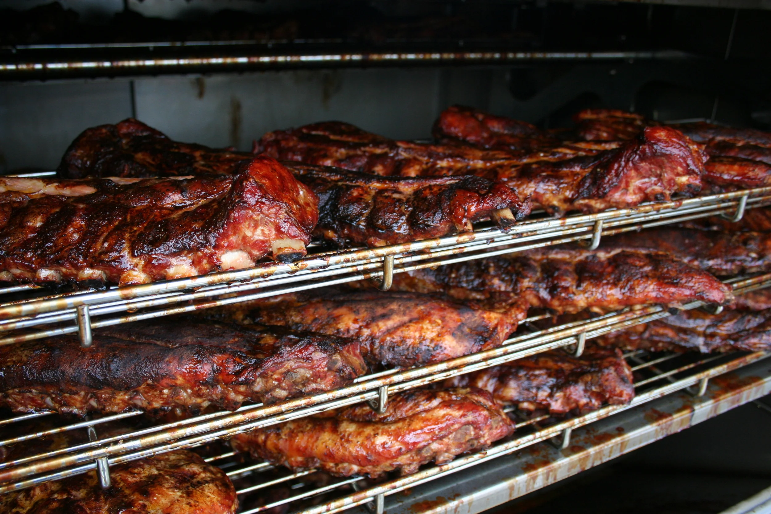 The smell of meats slow smoking with hickory, leaves a footprint on the brain.