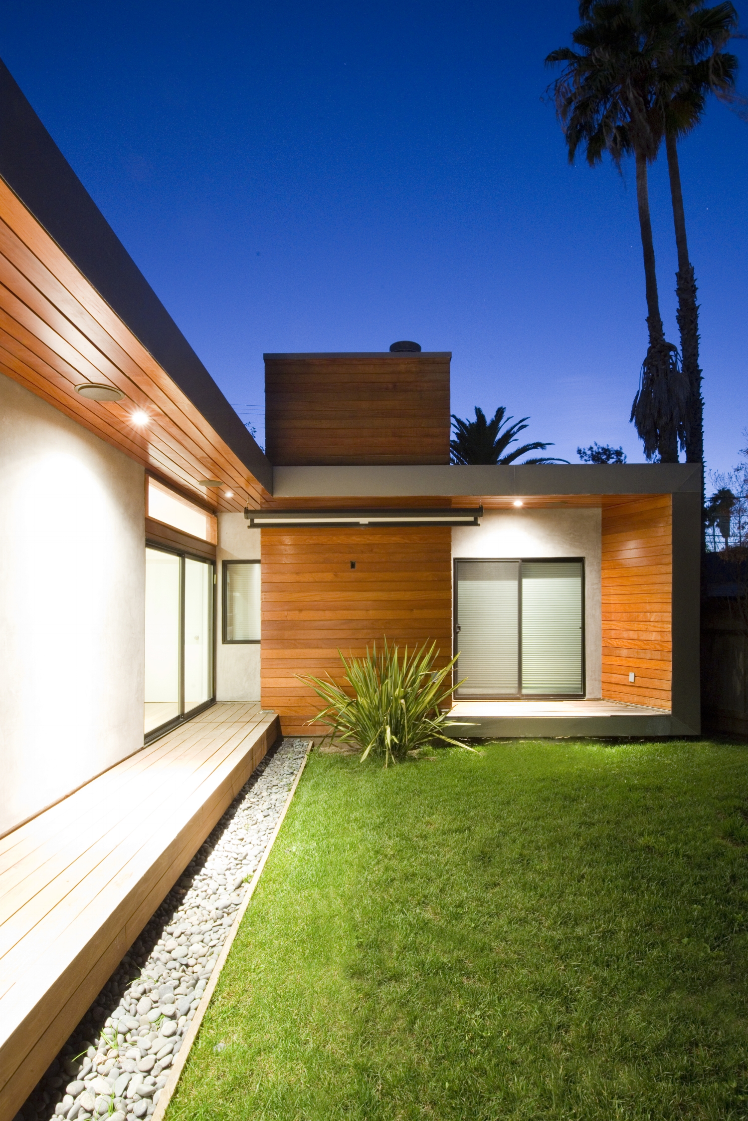 Martel Avenue is an Owner/ Builder project located in the heart of the Melrose District in Hollywood, CA. The existing 1,100 sqft home, built in 1923, was fully remodeled and an additional 1,400 sqft of contemporary living space was added. The site strategy was a courtyard scheme that presented an alternative approach from the typical front yard – rear yard housing layout. Three exterior spaces were designed and each proved to be distinct in its function and character. 