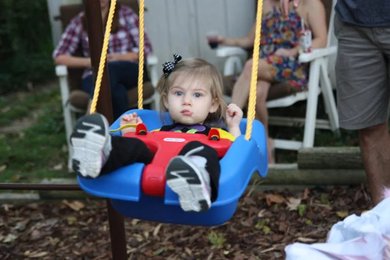 Olivia likes to swing as much as KW does!