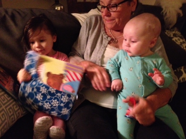 Opening one of her nightly Christmas books to read before bed. 
