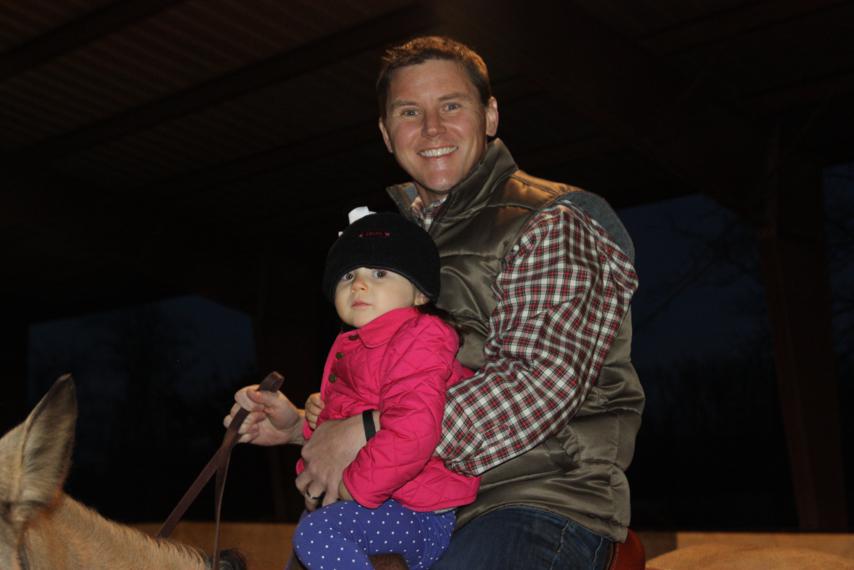 Katie Wynn riding with Daddy.