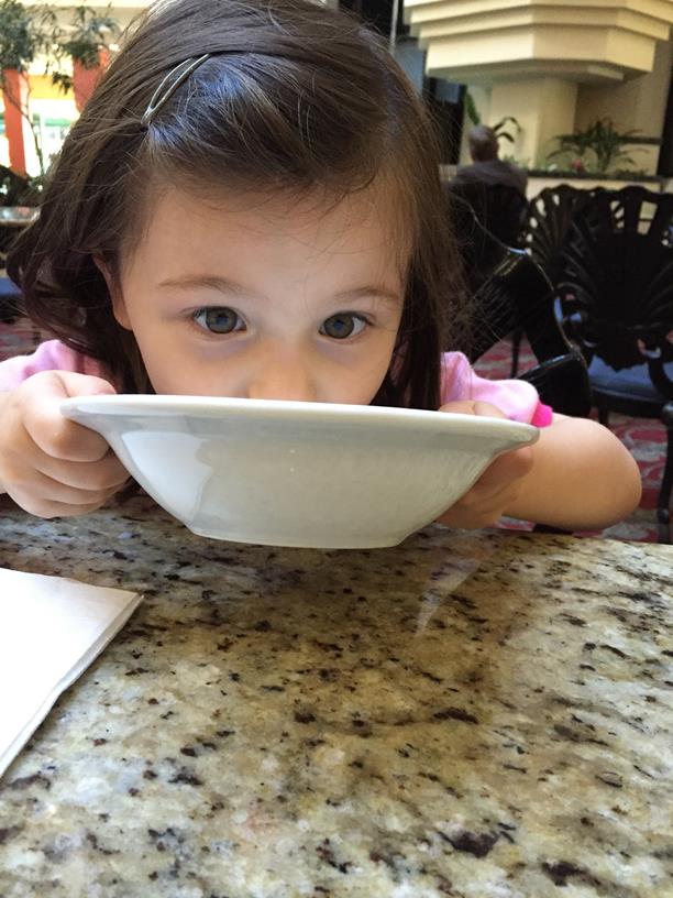 Drinking the sweet milk from the bowl!