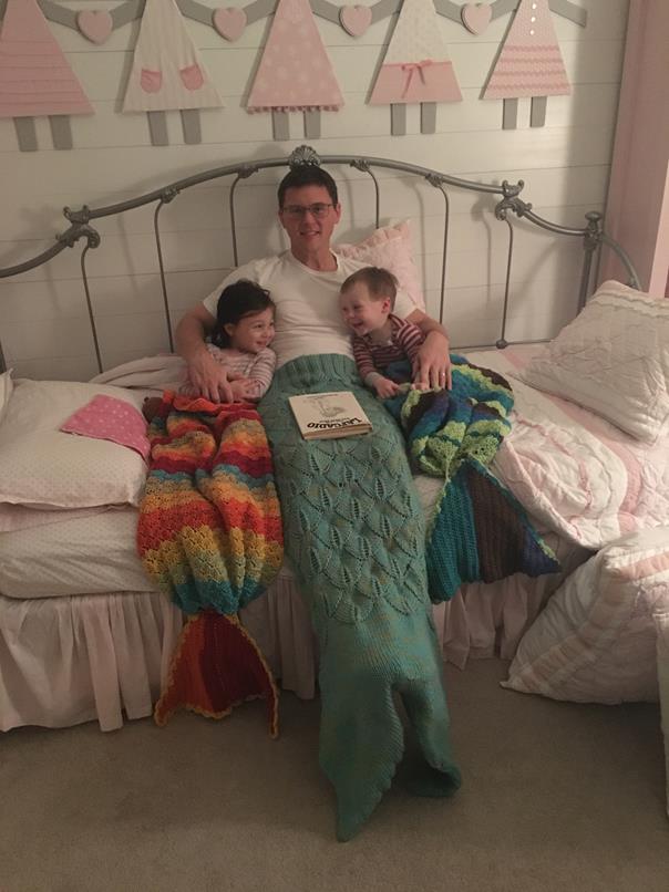 Wearing their mermaid and "mer-man" tails made by Lala and Aunt Jill.