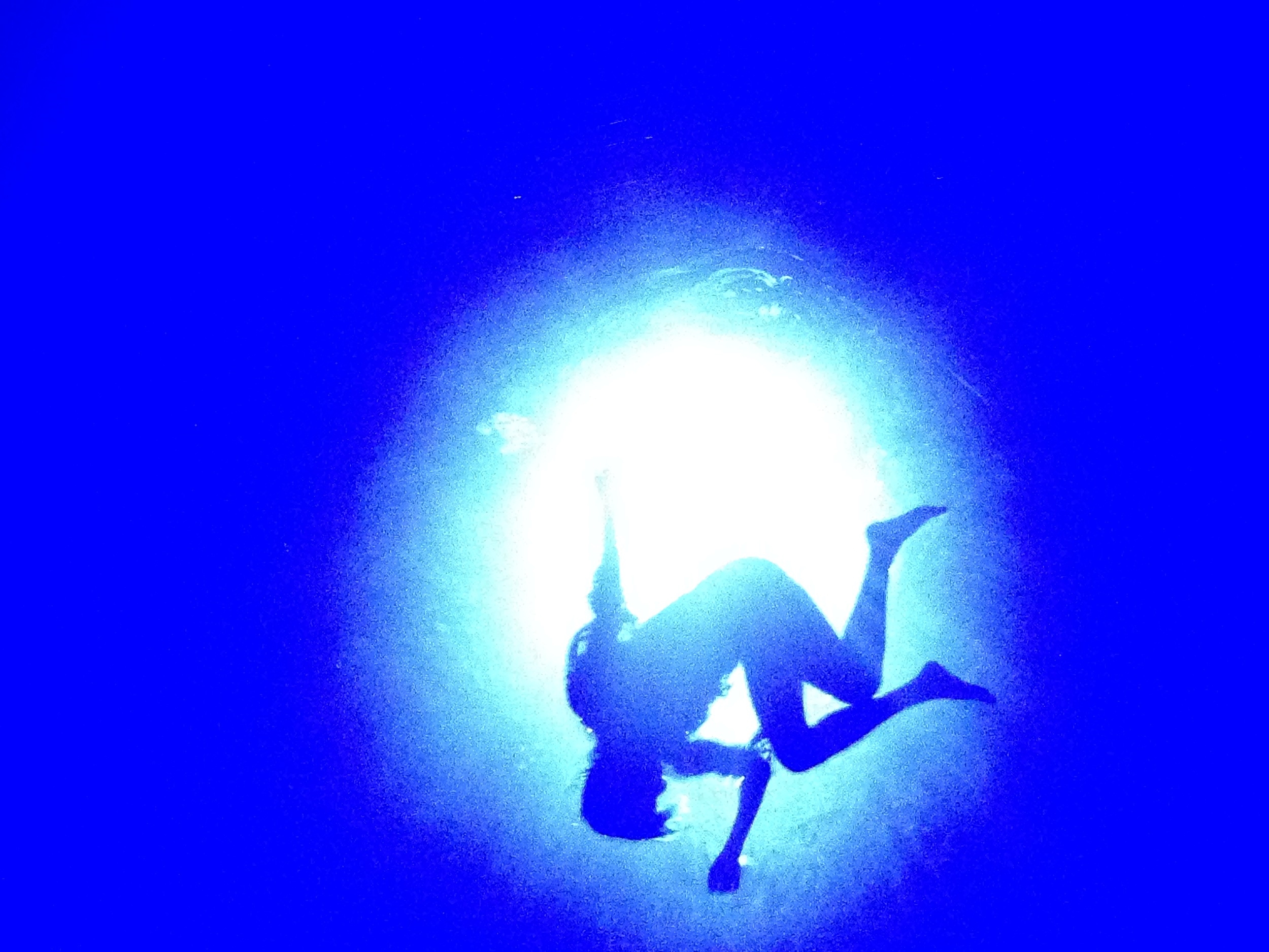 iphone capture of the amazing show Fuerza Bruta. Photo is looking up as a water filled ceiling approaches. I was WISHING my Nikon was in hand. :) This show is out of this world.