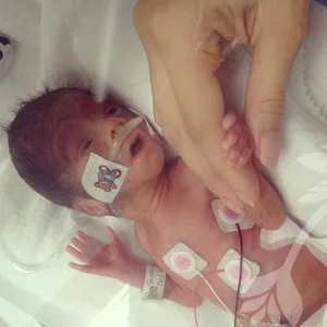 Precious baby Josiah, perfectly designed looking at his mommy for the first time